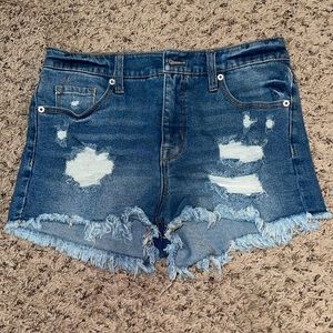 Medium wash distressed denim shorts